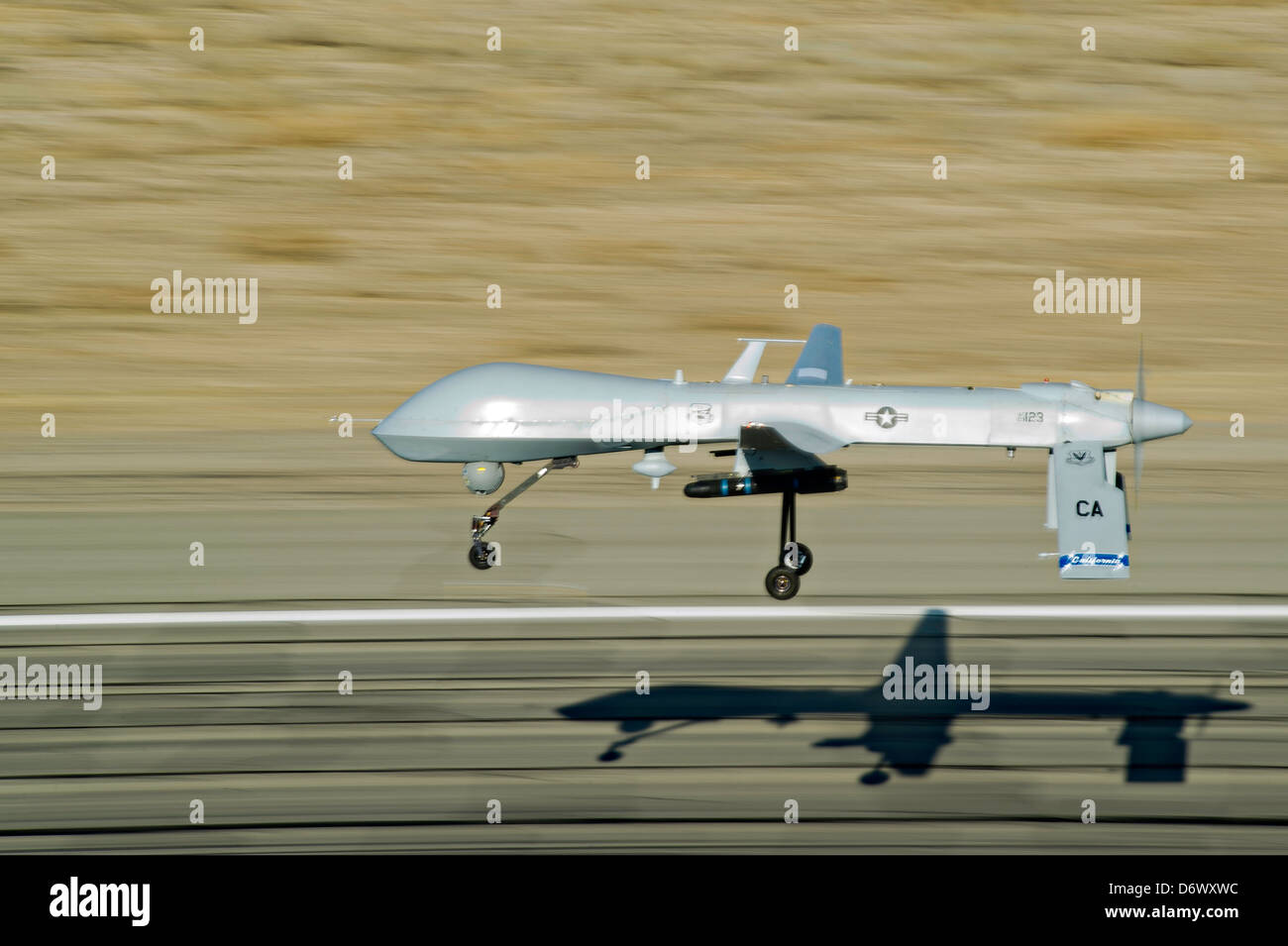 US Air Force MQ-1 Predator unmanned aerial vehicle assigned to the California Air National Guard's 163rd Reconnaissance Wing takes off at the Southern California Logistics Airport January 7, 2012 in Victorville, CA. Stock Photo