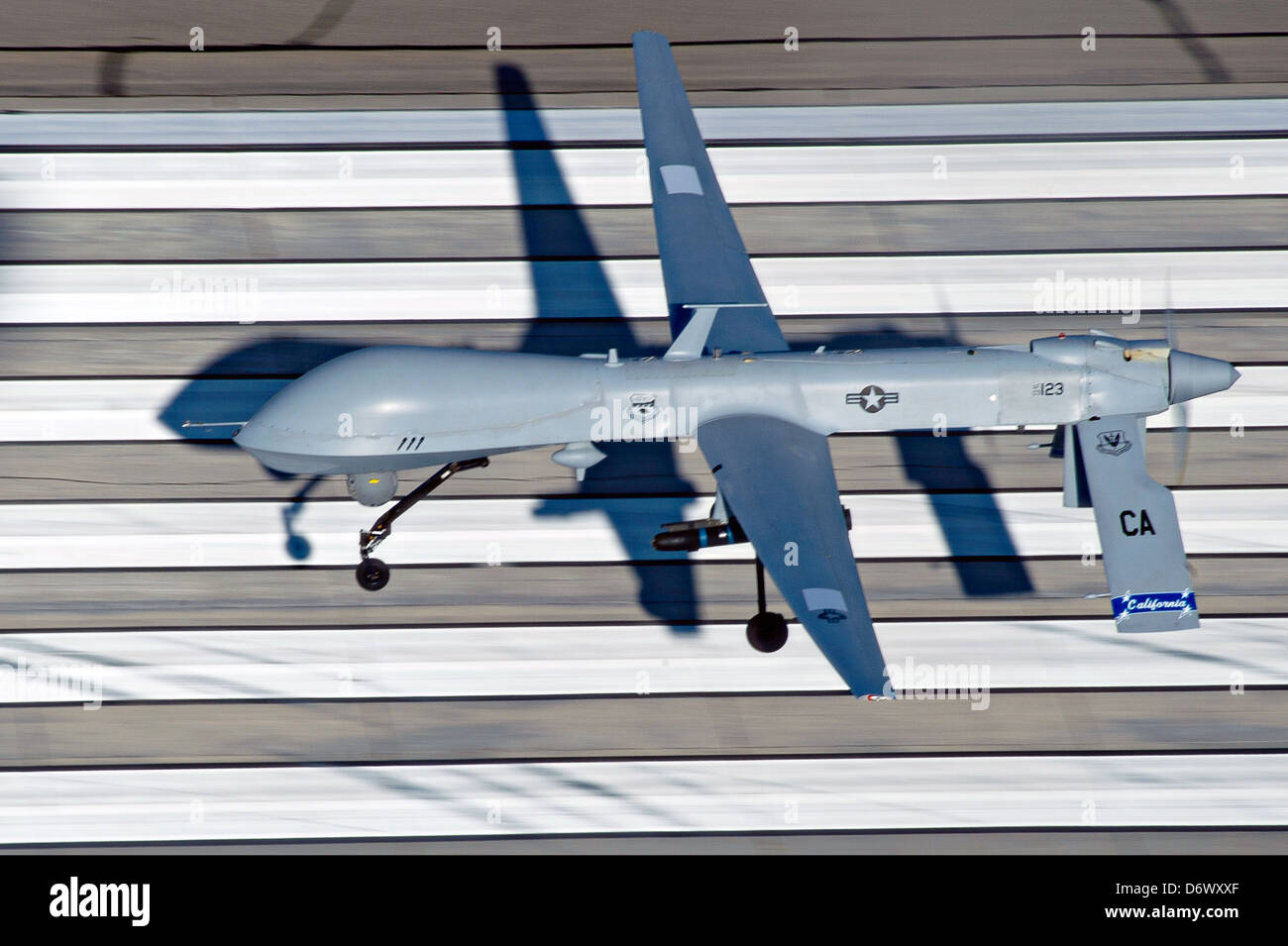 US Air Force MQ-1 Predator unmanned aerial vehicle assigned to the California Air National Guard's 163rd Reconnaissance Wing takes off at the Southern California Logistics Airport January 7, 2012 in Victorville, CA. Stock Photo