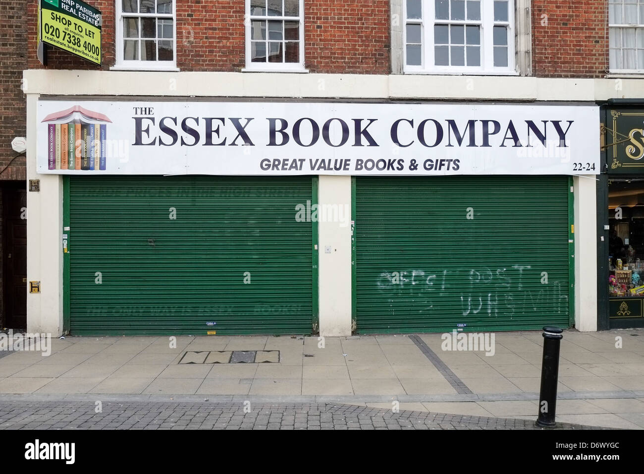 A closed and shuttered shop in Romford in Essex. Stock Photo