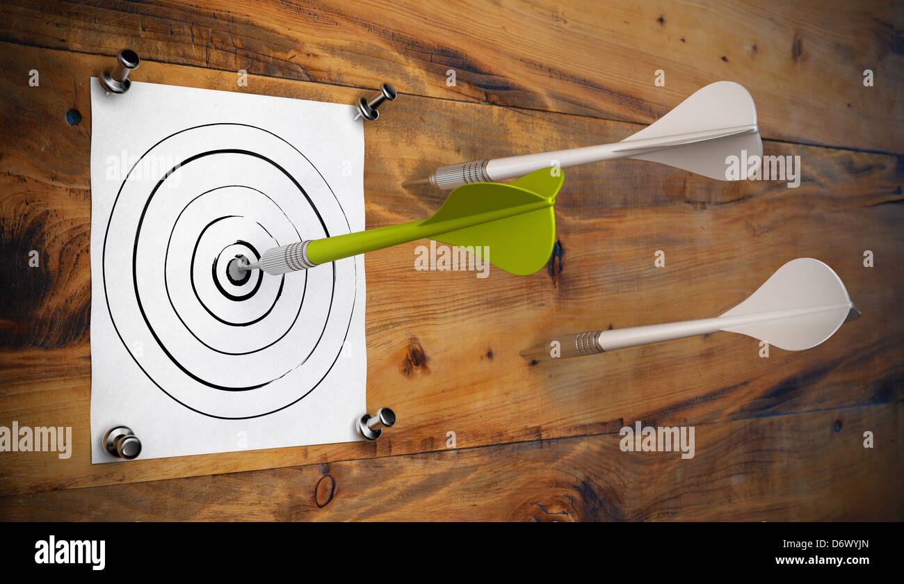 One green dart hitting the center of a hand made target fixed by 4