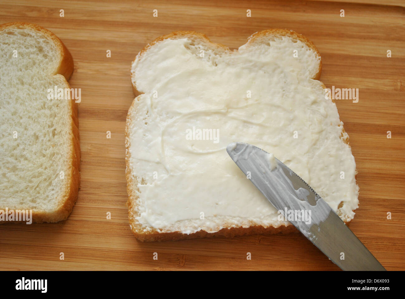 Speading Mayo on White Bread Stock Photo Alamy