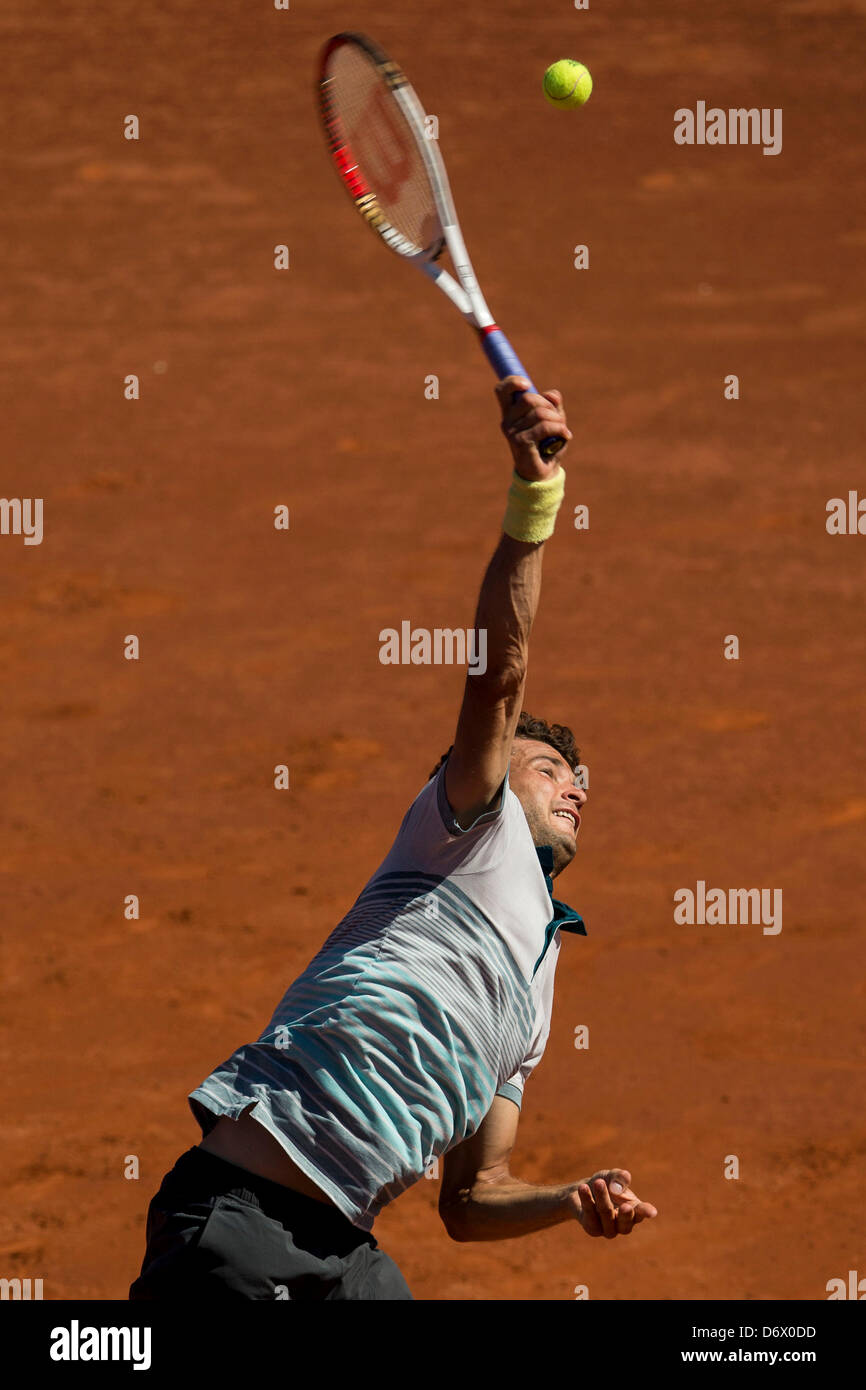 Barcelona, Spain. 24th April, 2013. Grigor Dimitrov of Bulgaria serves the ball to Tommy Robredo of Spain during day three of the ATP 500 World Tour Barcelona Open Banc Sabadell 2013 tennis training at the Real Club de Tenis  Barcelona Stock Photo