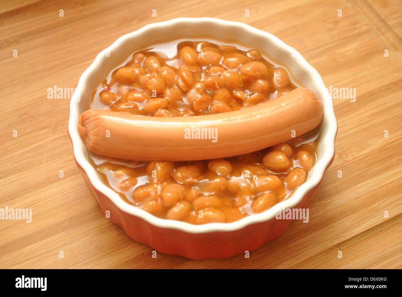 Bowl of Canned Baked Beans with a Hotdog on top Stock Photo Alamy