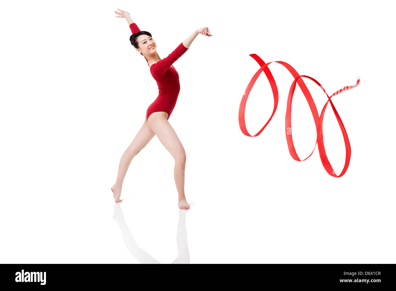 Female gymnast performing rhythmic gymnastics with ribbon Stock Photo Alamy