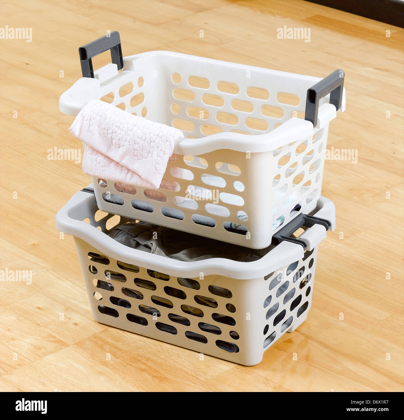 Stack of plastic baskets for laundry Stock Photo Alamy