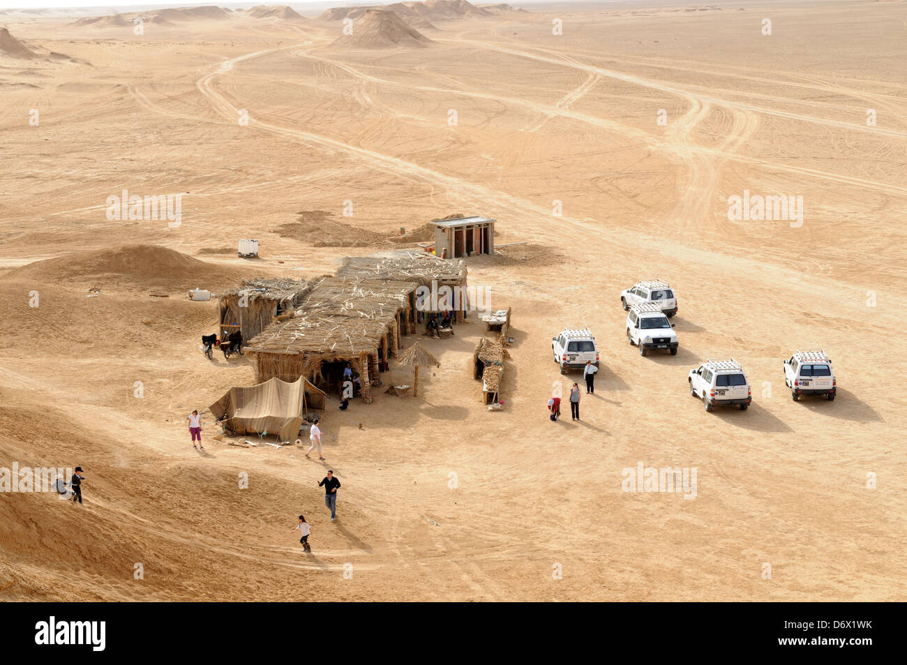 4x4 vehicles at a cafe near Ong Jemal Camel rock Sahara desert tunisia Stock Photo