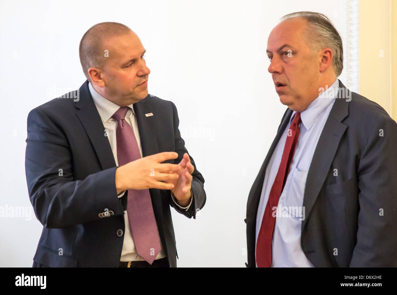 Chairman of Bosch Solar, Steffen Haack (L), and Thuringia's Economy Minister Matthias Machnig chat after a meeting of the SPD state parliamentary group and Bosch Solar in Arnstadt, Germany, 24 April 2013. Photo: Michael Reichel Stock Photo