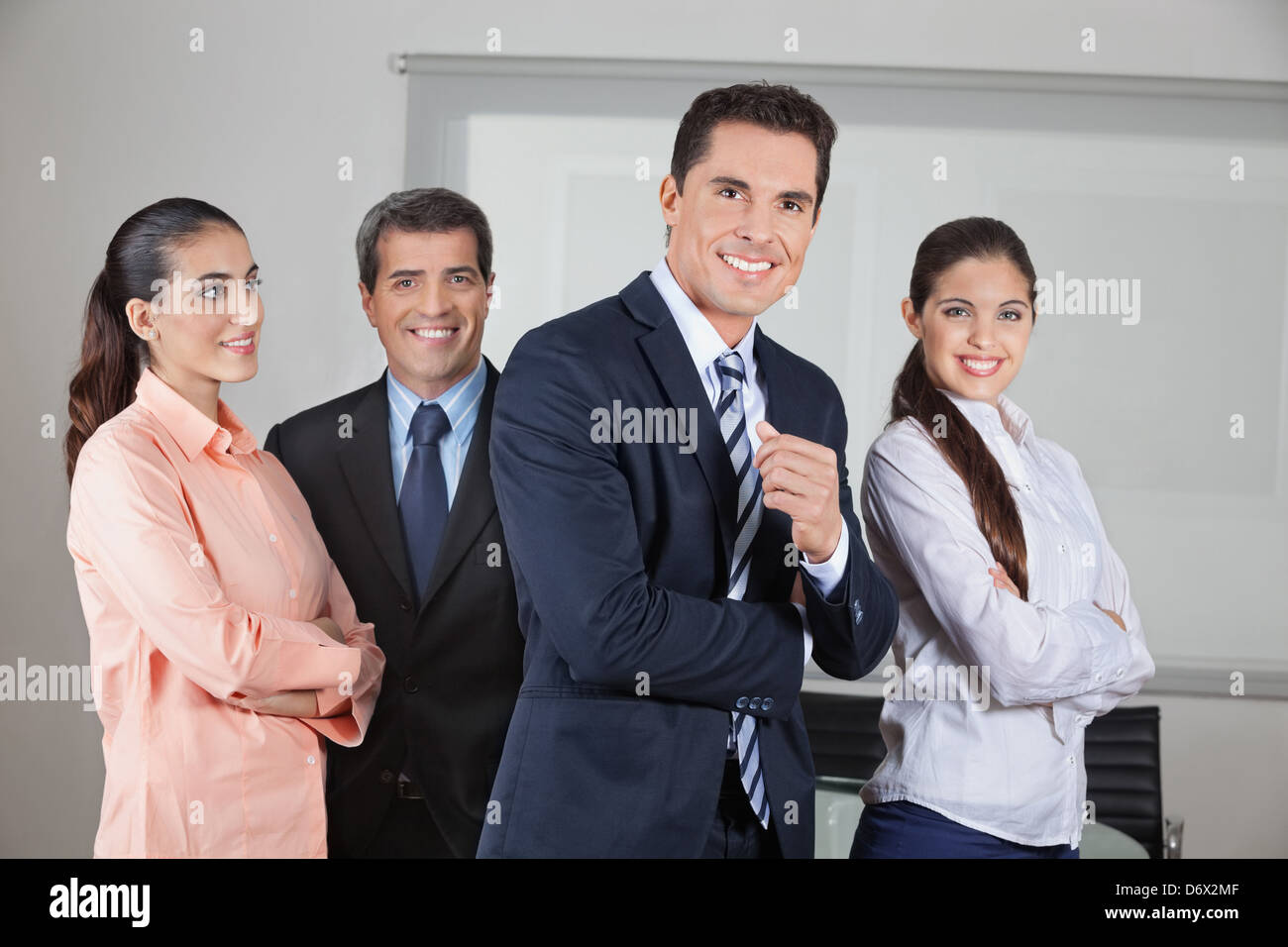 Portrait of smiling business office team with the arms crossed Stock ...