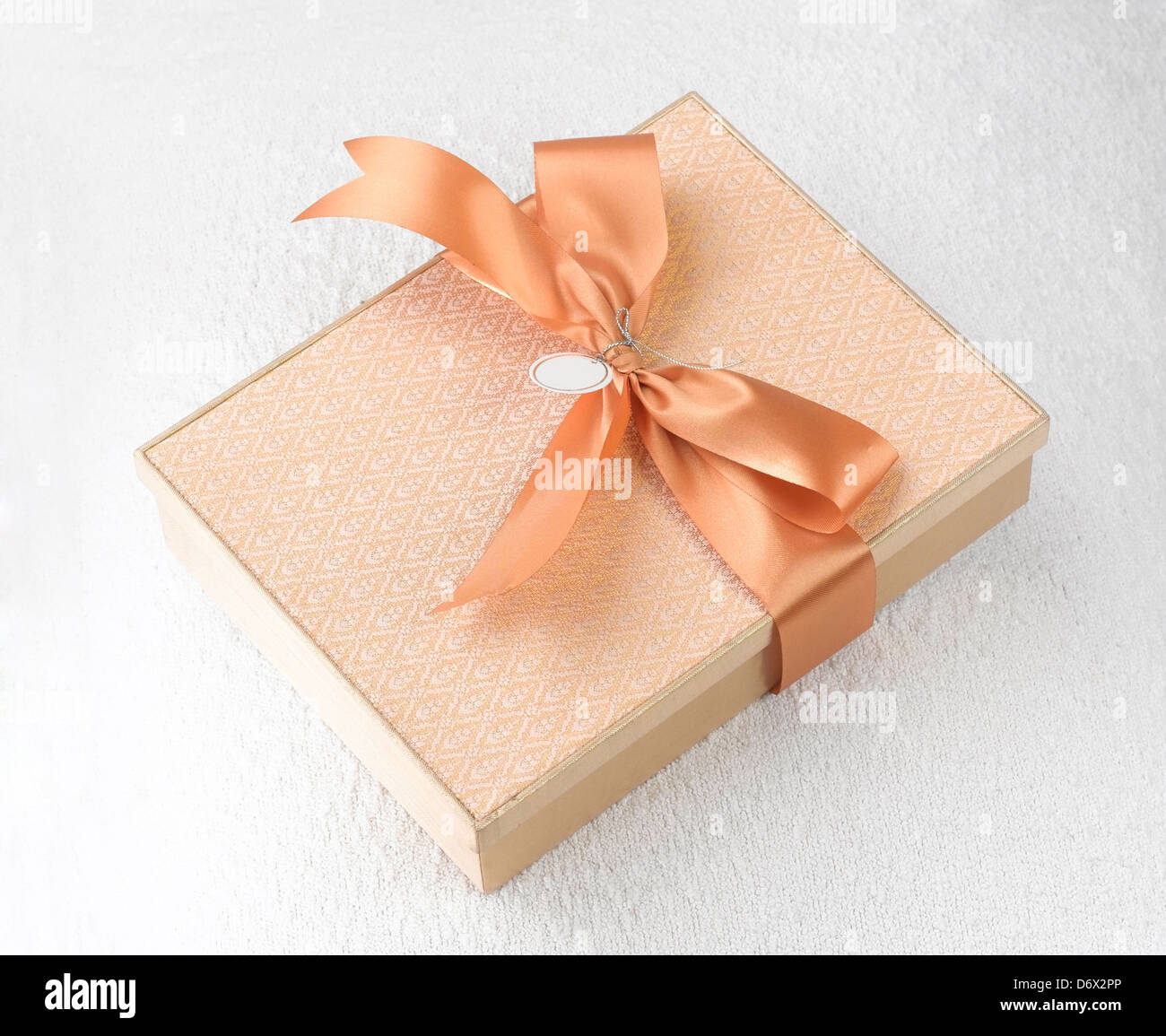 A beautiful fabric gift box with golden ribbon Stock Photo Alamy