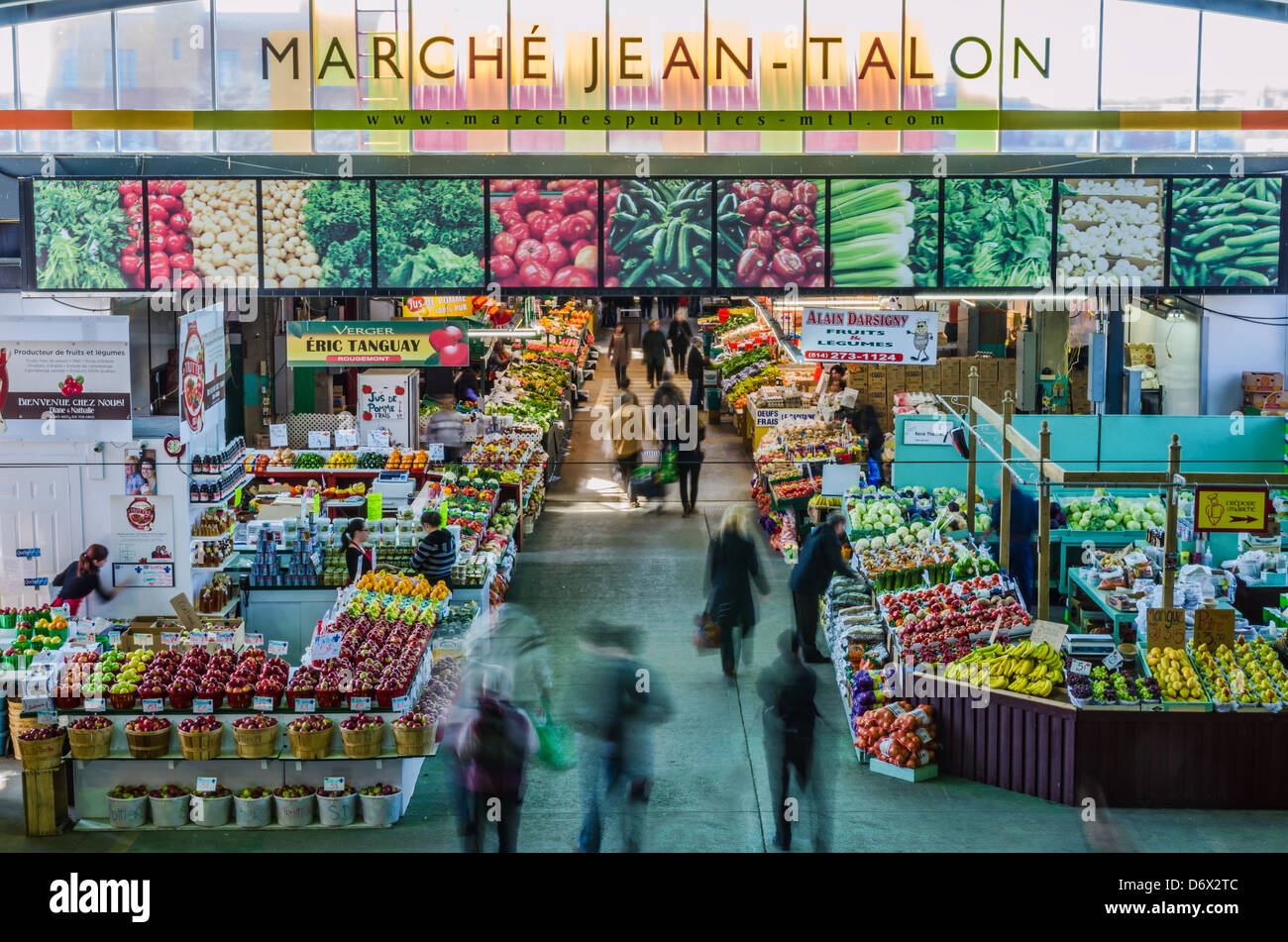 People buy groceries at Jean-Talon Market, the largest outdoor public market in North America. Stock Photo