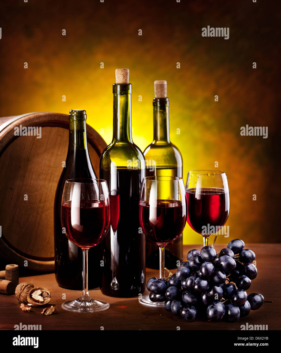 Still life with wine bottles, glasses and oak barrels Stock Photo - Alamy
