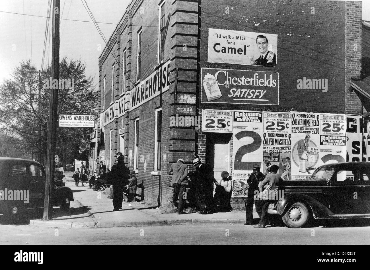 STREET SCENE 1939 in Mebane, North Carolina, USA, Note the many posters