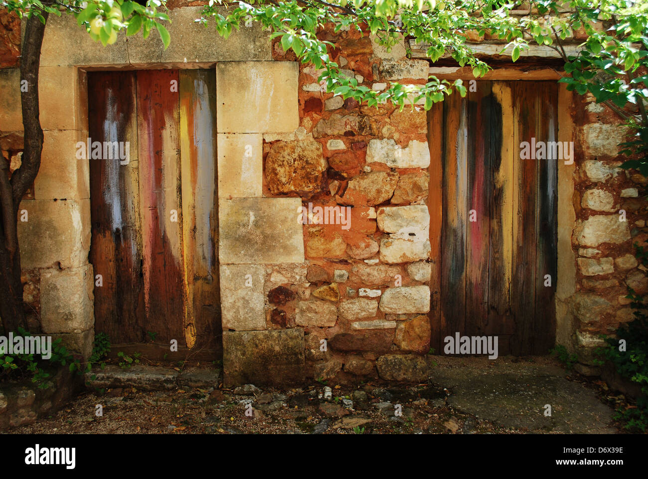 Two colorful painted doors in ocher historical village of Roussillon, Provence, France Stock Photo