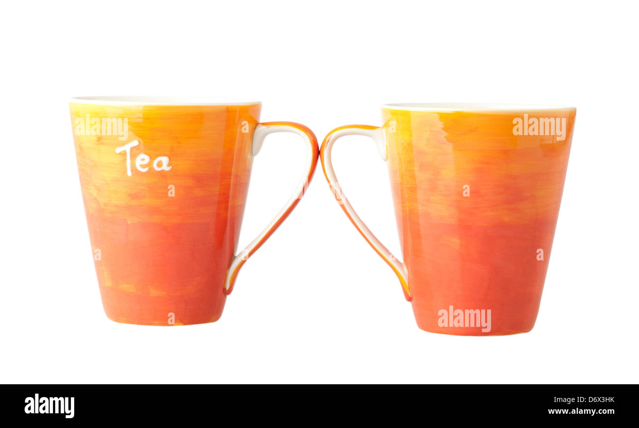 Two colorful porcelain tea mugs on white background Stock Photo