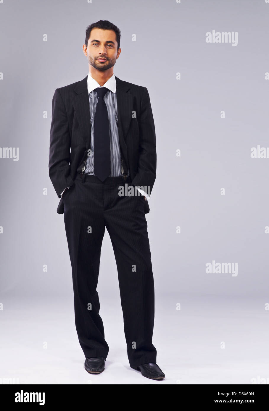 Full length portrait of a young executive standing in a studio Stock Photo