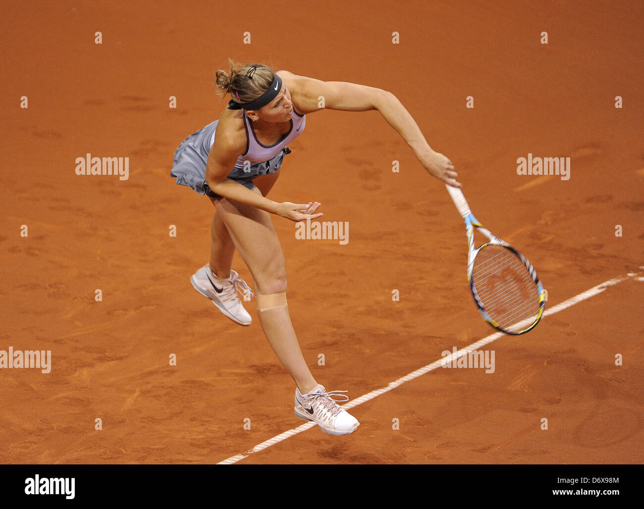 Lucie Safarova from the Czech Republic serves the ball during the first-round match of the WTA Tennis Grand Prix against Barthel from Germany at Porsche Arena in Stuttgart, Germany, 24 April 2013. Photo: DANIEL MAURER Stock Photo