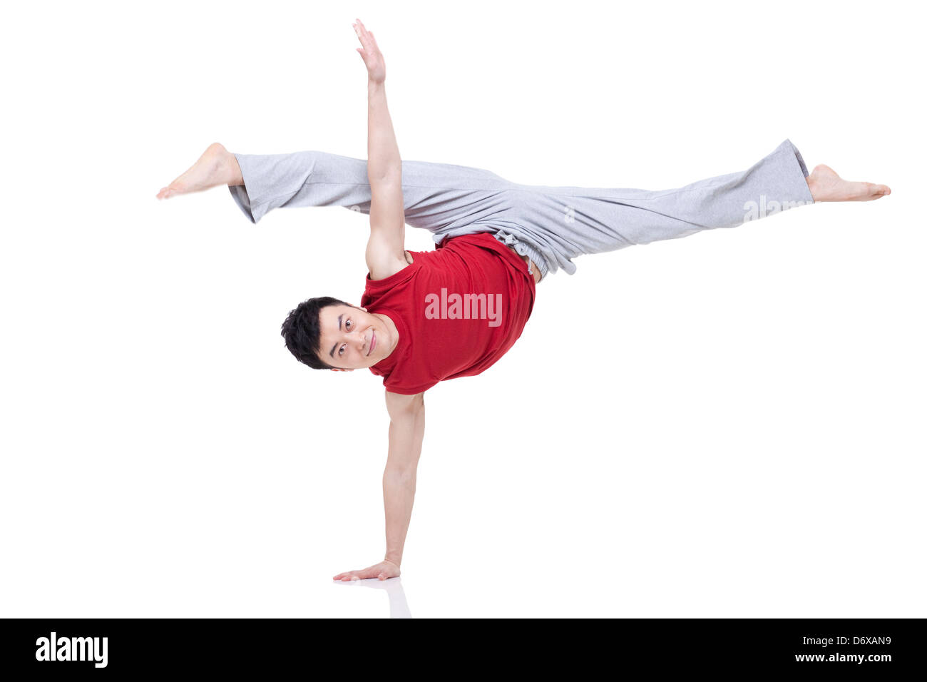Young man doing yoga Stock Photo - Alamy