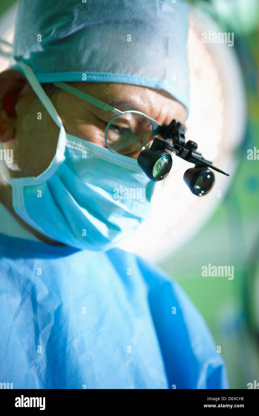 a surgeon wearing a medical loop glasses Stock Photo - Alamy