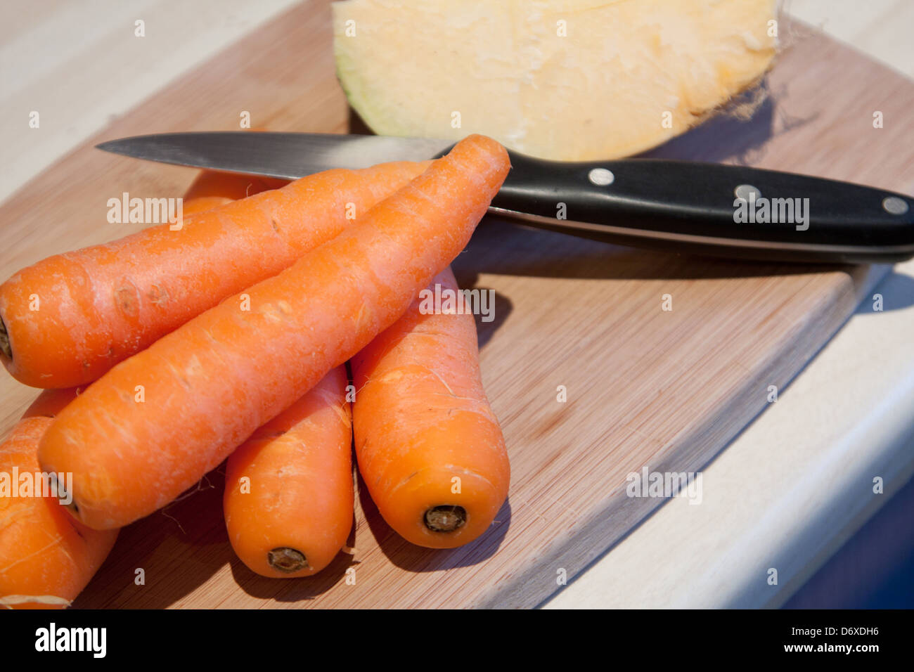 Carrot, swede and knife Stock Photo