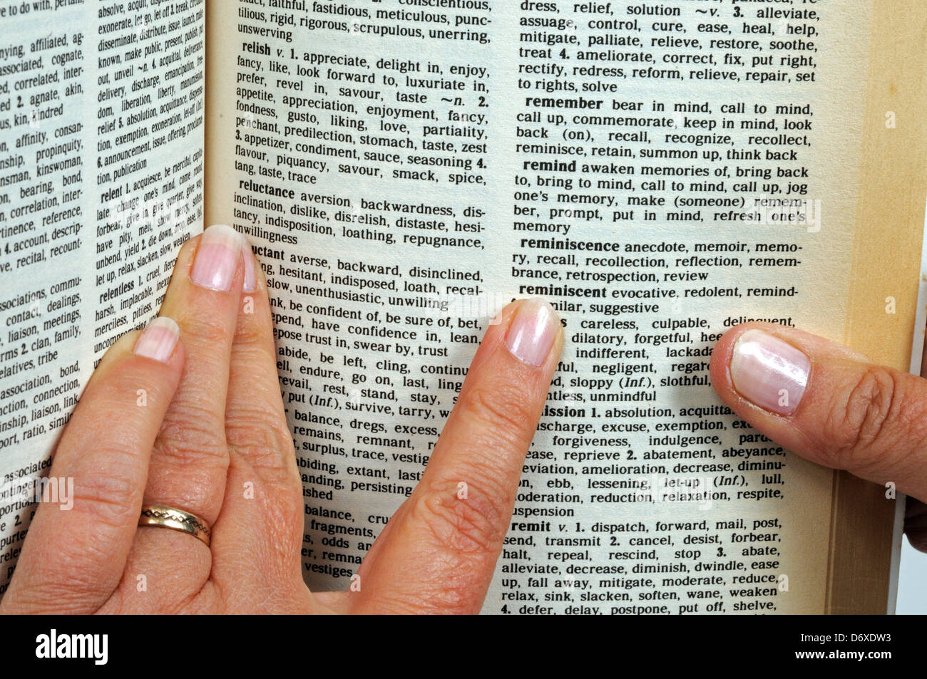 Pointing a finger at words in a thesaurus, England, UK, Western Europe. Stock Photo