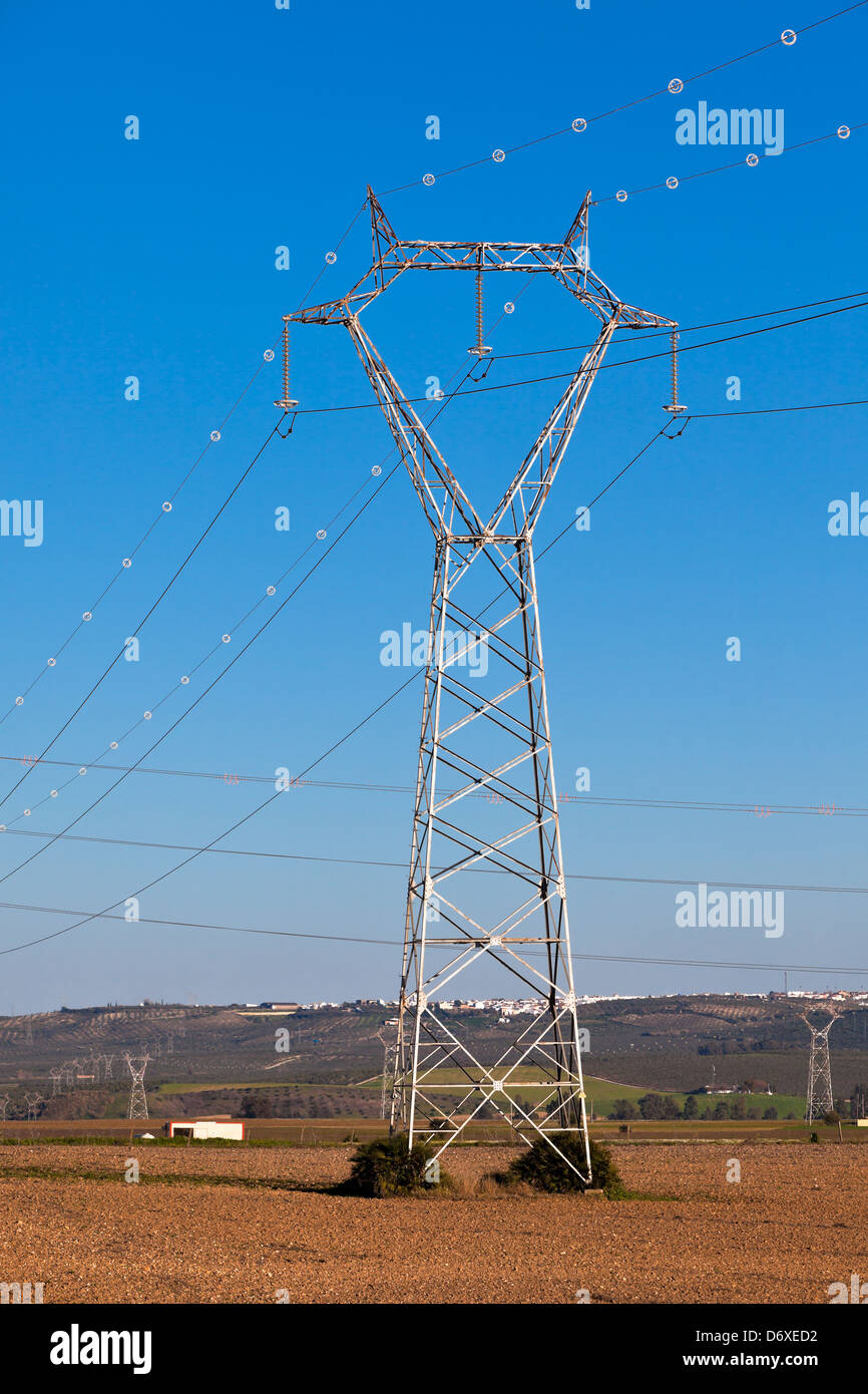 Electricity Power Pylons against Bright Blue Sky at a Beautiful ...