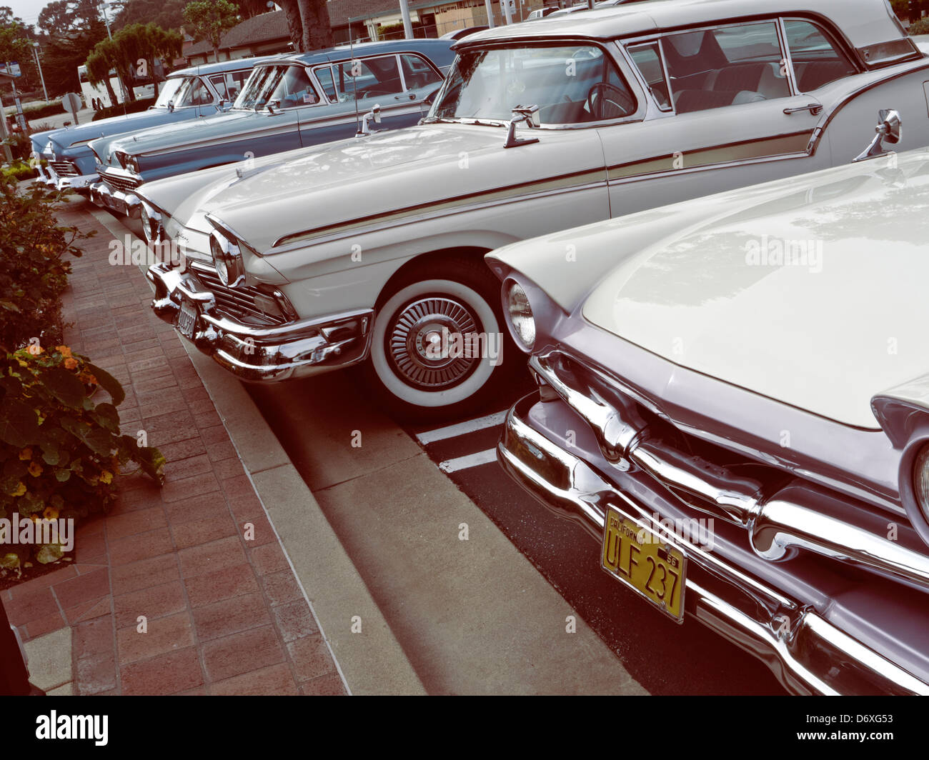 Line of 1950's Ford Fairlane Skyliner American classic motor cars parked at Carmel California USA with retro colour effect Stock Photo