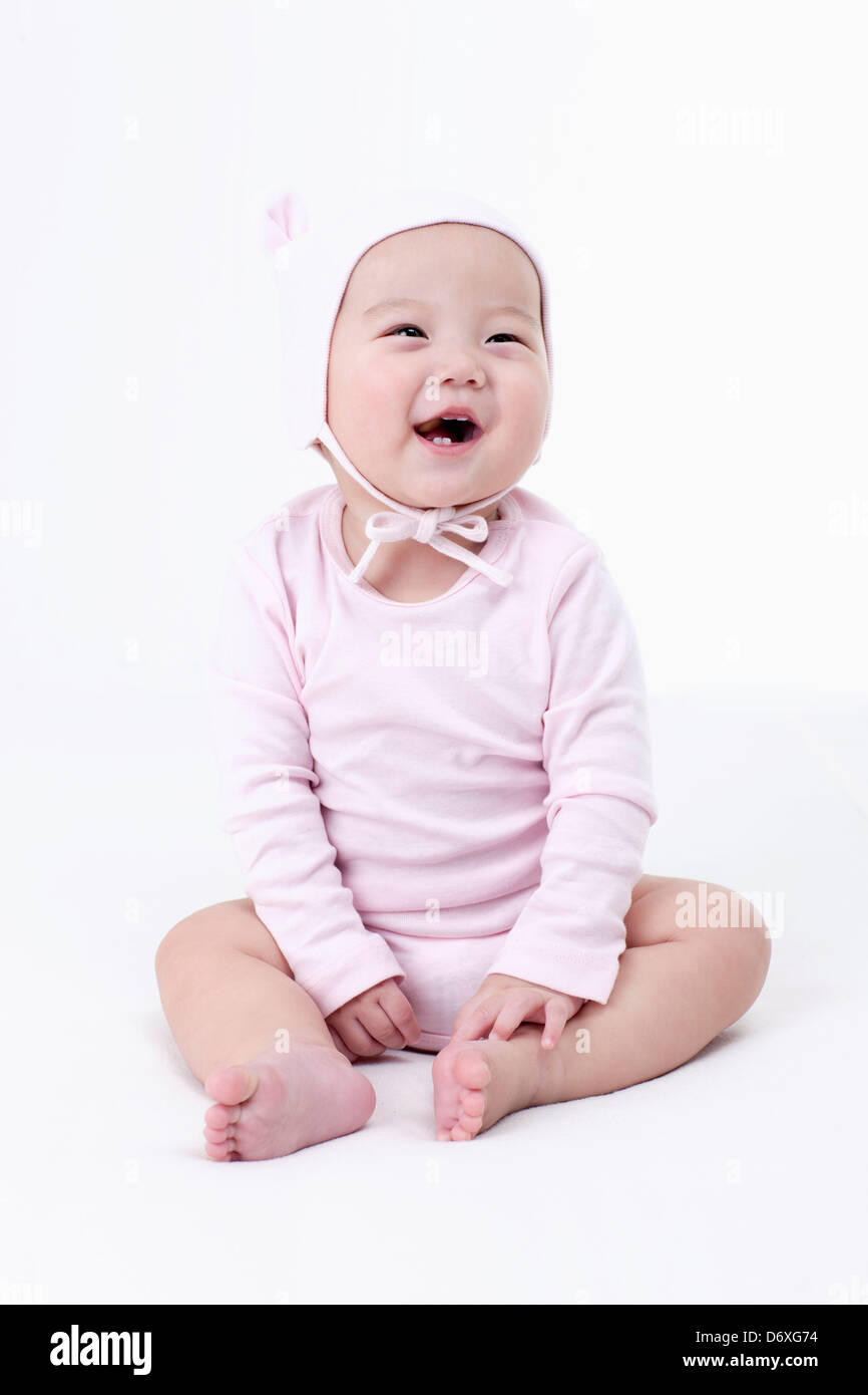 a baby smiling in white background Stock Photo - Alamy