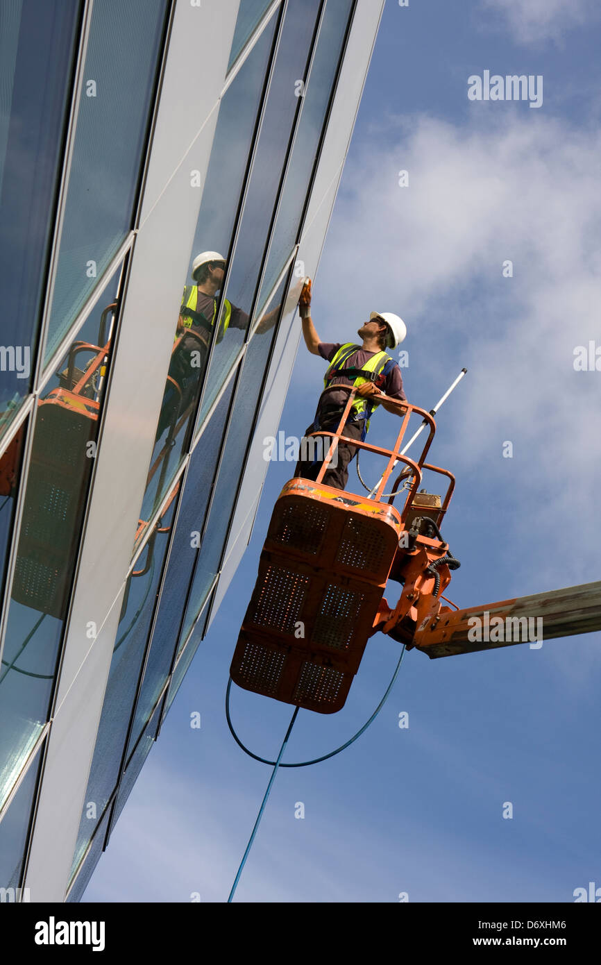 High level external building clean using access boom. Stock Photo