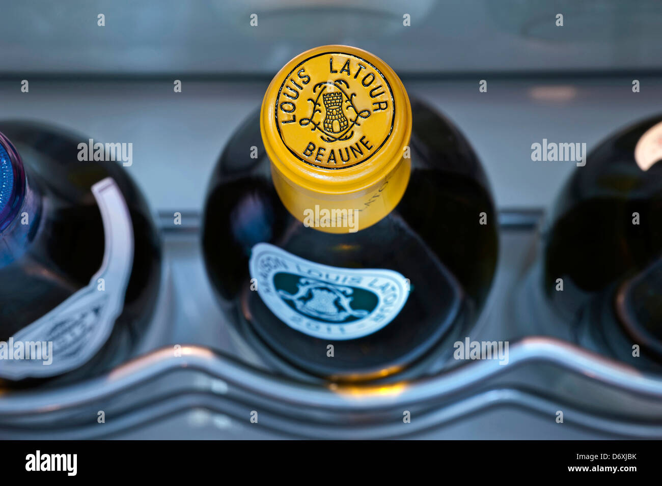 Louis Latour fine white Burgundy wine bottle stored in controlled temperature wine cabinet Stock Photo