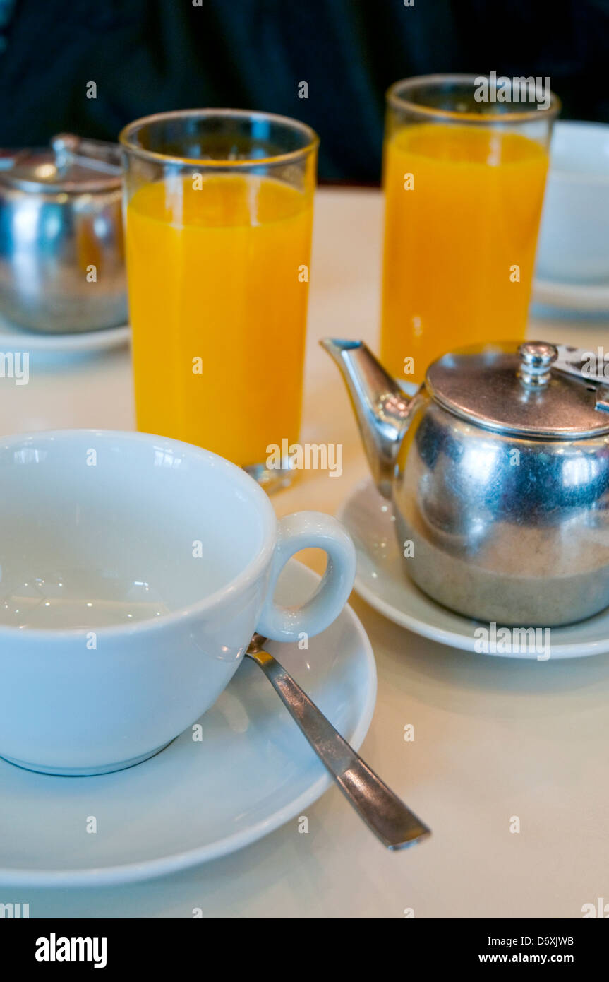 Tea and orange juice. Close view. Stock Photo