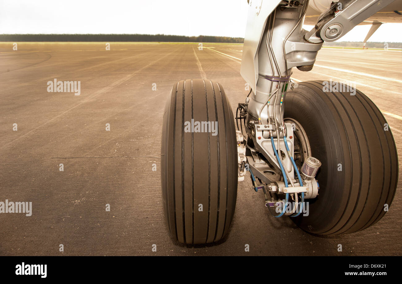 Landing gear, wheels on the runway, close up Stock Photo