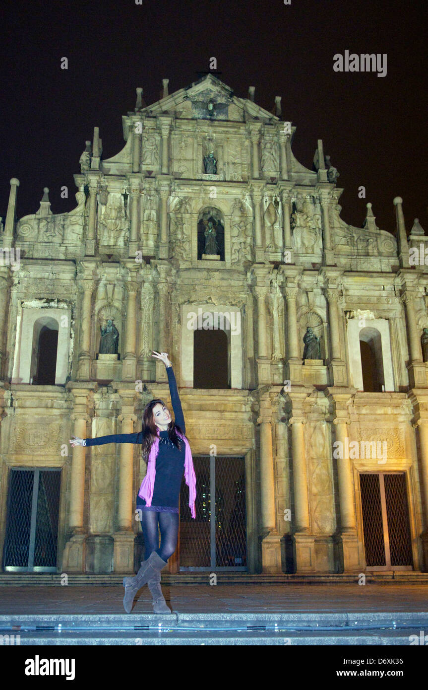 Ruins of St Paul's Church at night with pretty girl posing Macau Stock Photo