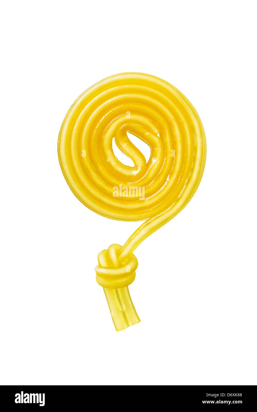 Yellow circular fruit gum snail with a knot on white background Stock Photo