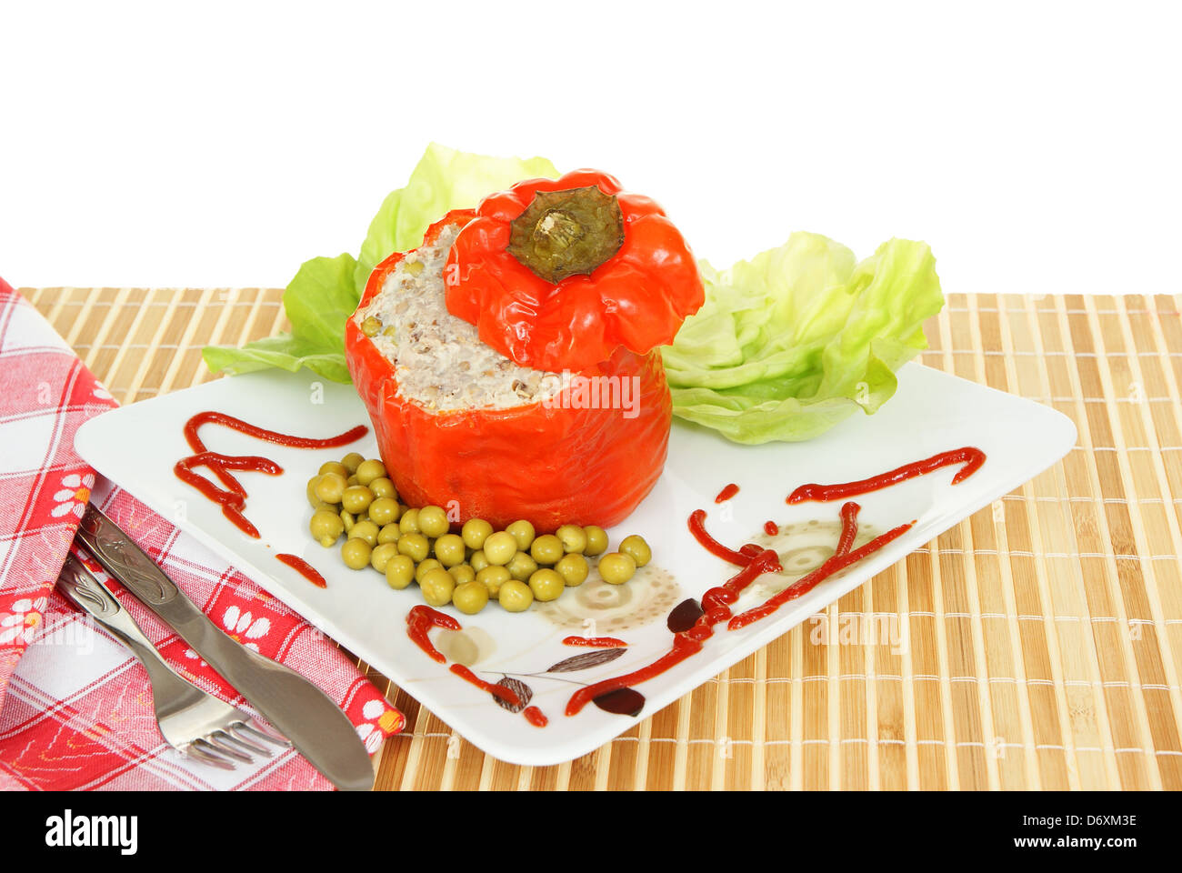 red pepper stuffed meat and buckwheat on plate Stock Photo