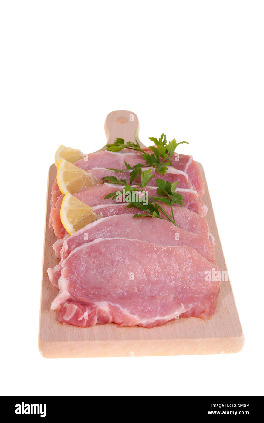 part of pork loin on board isolated on white background Stock Photo