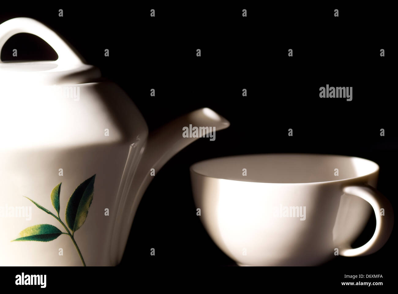 white porcelain kettle and cup to tea Stock Photo Alamy