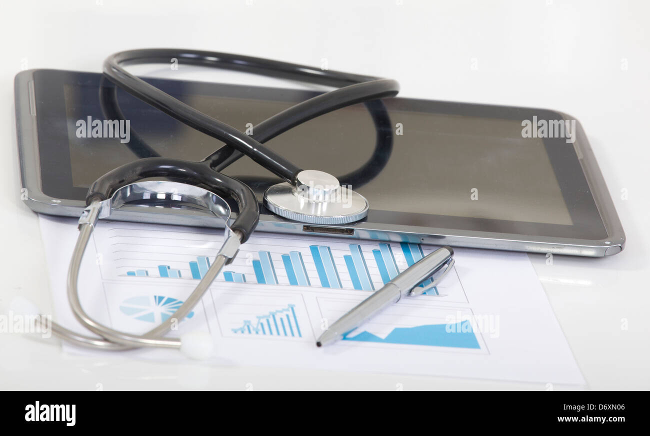 Digital tablet with stethoscope and paperwork Stock Photo - Alamy