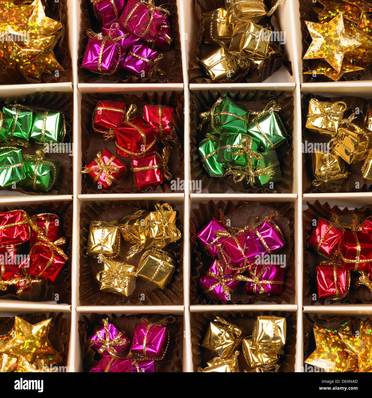 Box with separate compartments holding brightly coloured wrapped