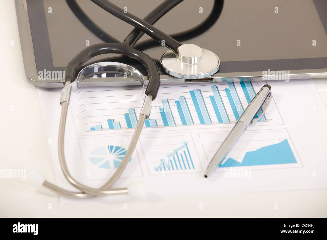 Digital tablet with stethoscope and paperwork Stock Photo - Alamy