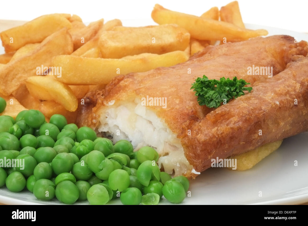 Close-up of a plate of fish, chips and peas - shallow depth of field Stock Photo