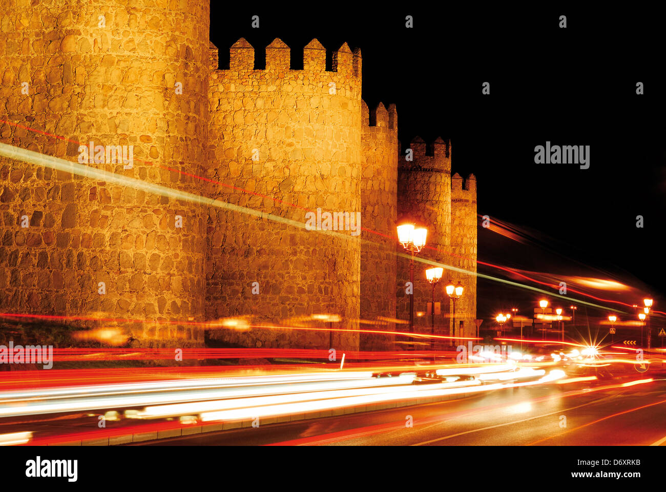 Spain, Castilla-Leon: Evening traffic in front of the medieval town wall of  World Heritage town Ávila Stock Photo