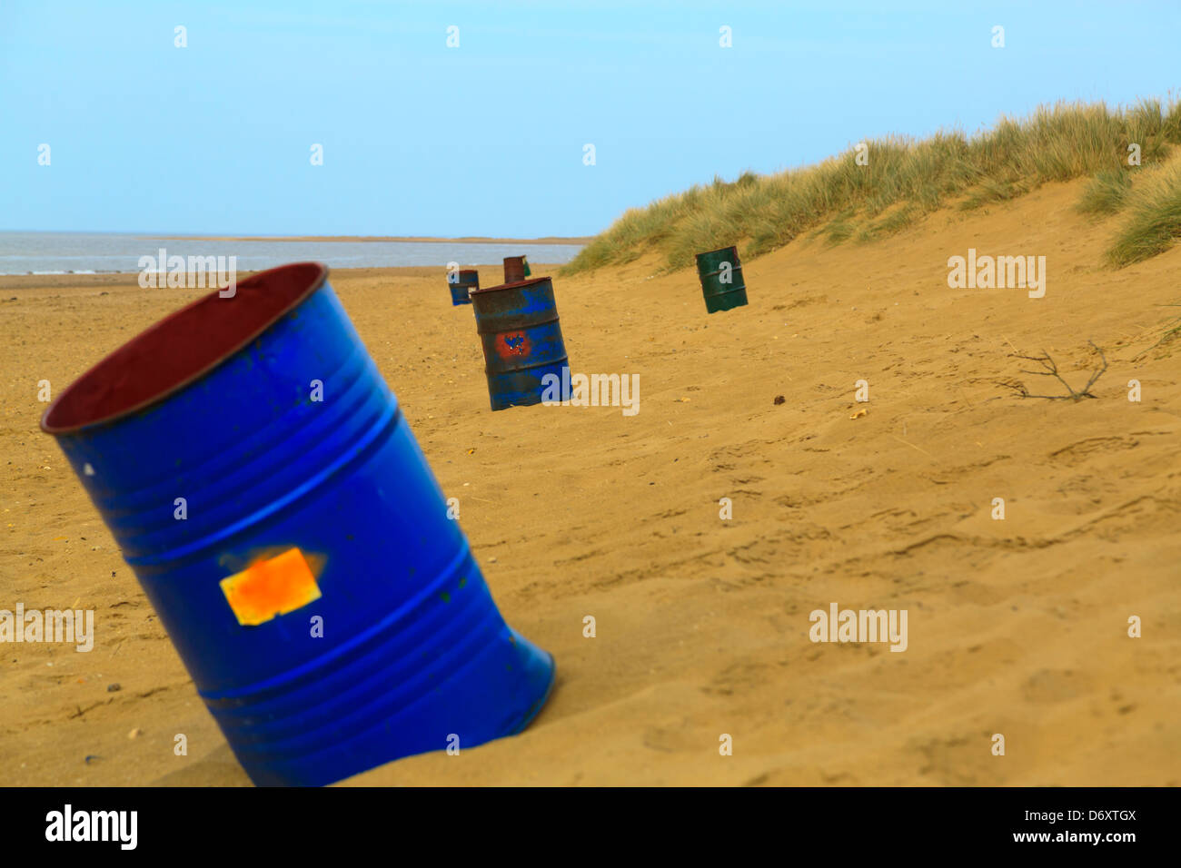 Abandoned metal drums on Hunstanton beach, Norfolk, England Stock Photo