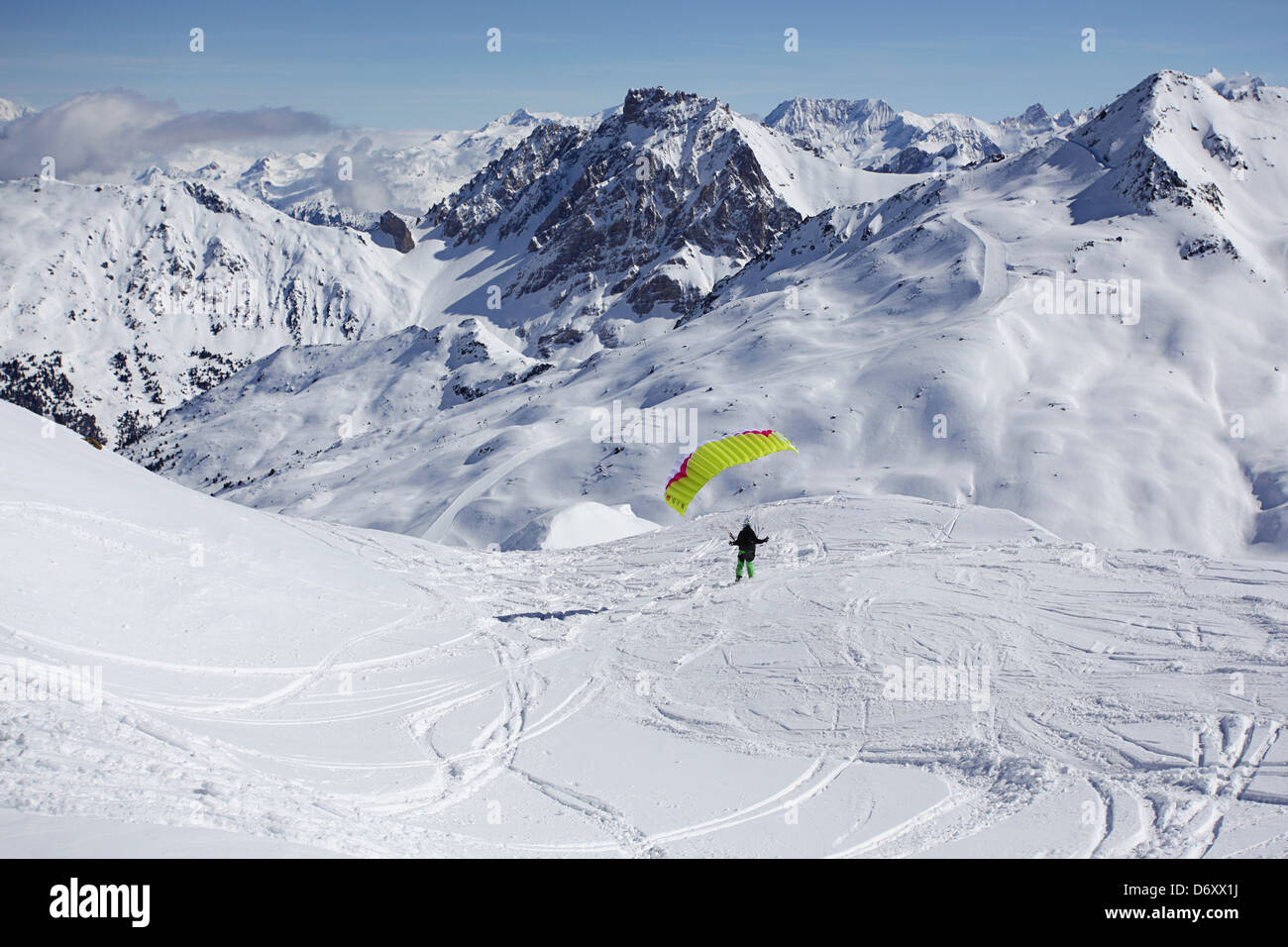 Speed riding with ski's and a small fast fabric wing in the Alps, France Stock Photo