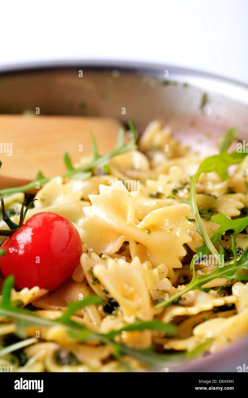 Bow tie pasta with pesto and arugula Stock Photo Alamy
