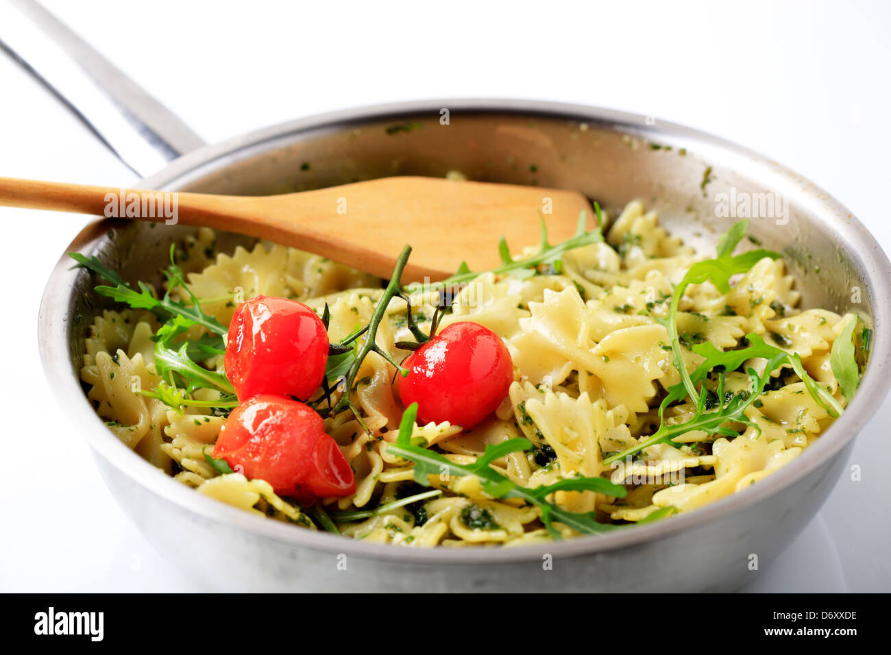 Bow tie pasta with pesto and arugula Stock Photo Alamy