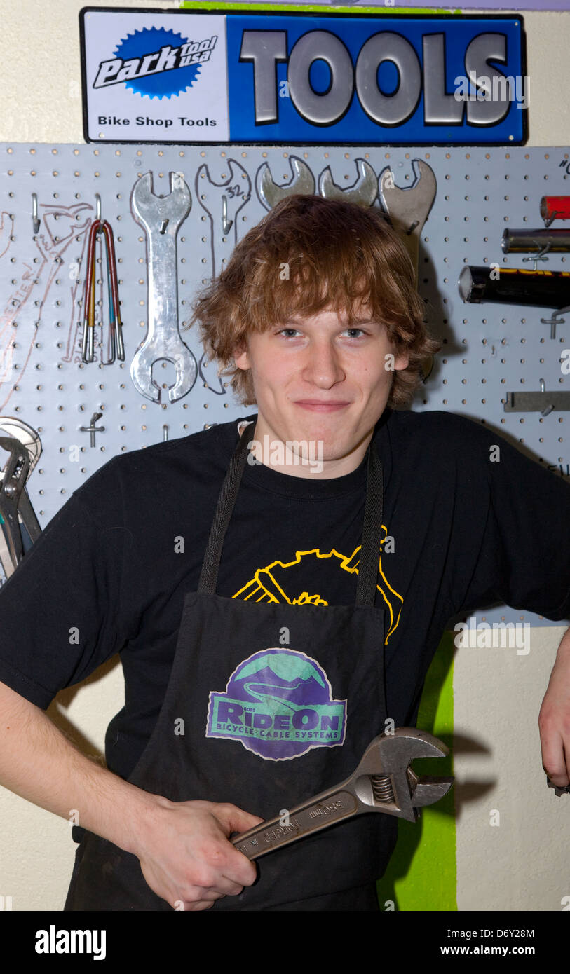 One determined bicycle repair guy ready with wrench at the nonprofit