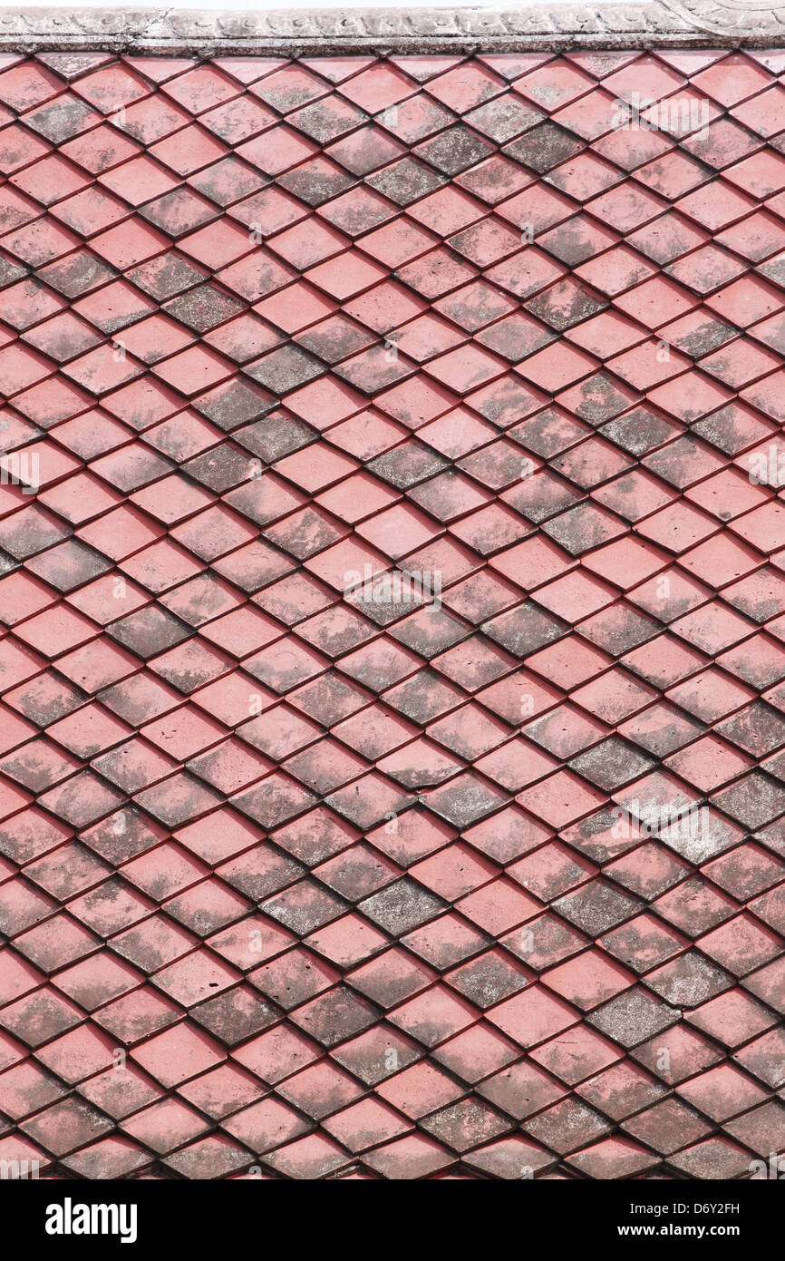 Red old Tiles roof in The Temple of Thailand. Stock Photo