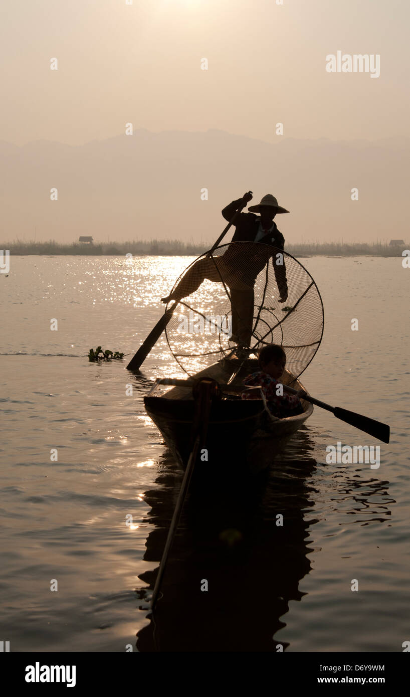 Silhouette of leg rowing fisherman on Inle Lake Myanmar (Burma Stock ...