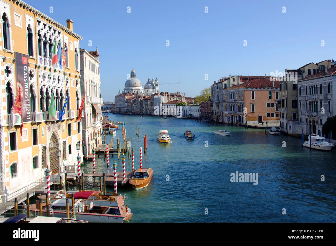 Gondolas in a canal with a church in the background, Santa Maria Della Salute, Grand Canal, Venice, Veneto, Italy Stock Photo