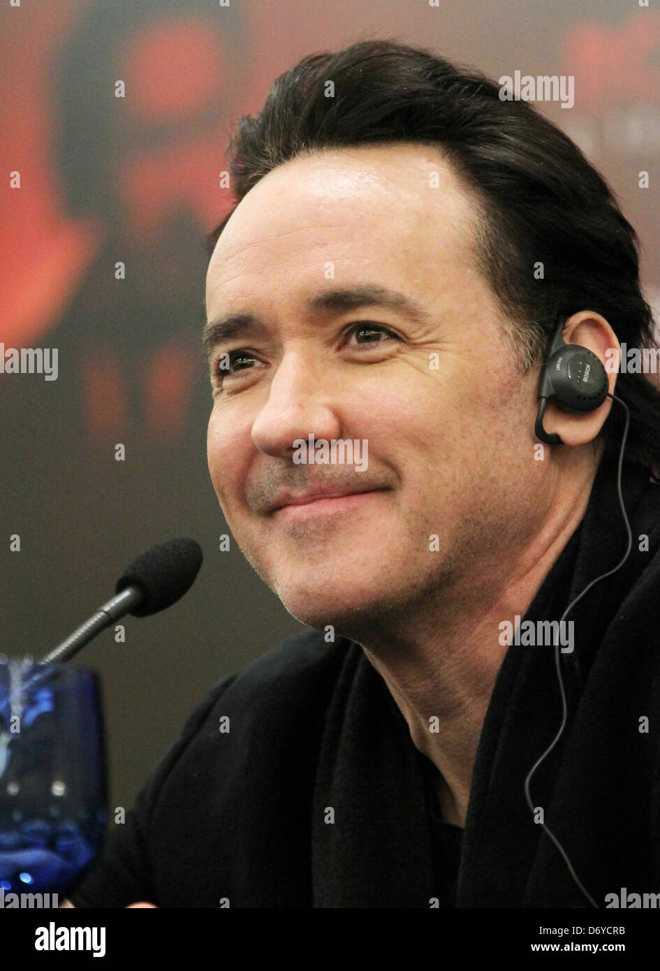 John Cusack attends a press conference for his movie 'The Raven' in